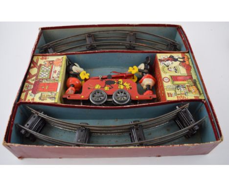 Boxed Wells O' London (Brimtoy) Mickey Mouse Handcar. Made in England. Set comprises of clockwork handcart and cardboard 'Goo