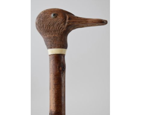 Traditional hand crafted walking stick, wooden handled, in the form of a duck's head, ash (or similar) shaft, 128cm long.  Co