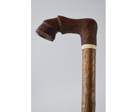 Traditional hand crafted walking stick, wooden handled, in the form of a hoof, ash (or similar) shaft, 124cm long. Collection