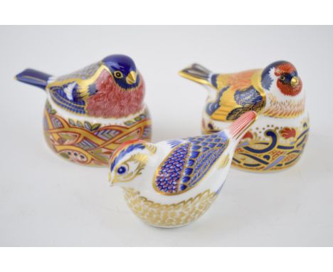 Three Royal Crown Derby bird paperweights, Bullfinch Nesting and Goldfinch Nesting, both 6.7cm high, date code for 1997 (LX) 