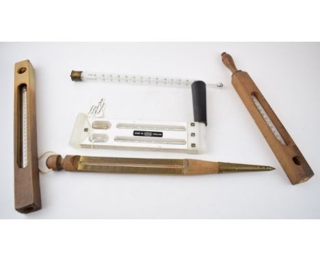 A collection of thermometers to include a flaoting dairy example, a Casella of London whirling thermometer, an Accosion examp