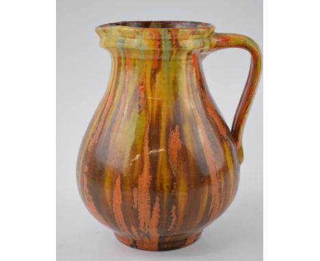 Brannam of Barnstaple glazed studio pottery jug. Brown, yellow and orange glaze. c1930s. Height 19cm.  In good original condi