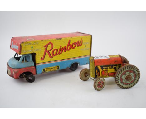Mettoy tinplate model of a tractor, with blue wheels and a red body, with a vintage tin plate 'Rainbow' advertising lorry (2)