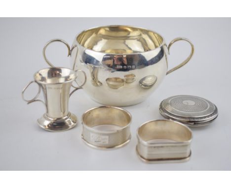 A collection of fully hallmarked sterling silver items to include napkin rings, two handled bowl (height 6.5cm width 15cm), a