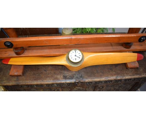 Airplane propeller with mechanical brass bulkhead clock. Wooden propeller in original varnish finish with red painted tips. P