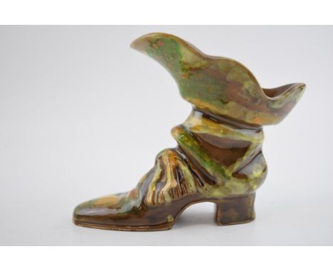Minghetti Bologna pottery model of a boot, in brown and green glaze, 17cm tall.  Condition generally good, some chips to left