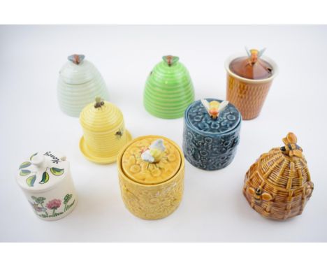 A collection of pottery honey pots in varying forms and colours to include Selca, Goebel and others (8).  Condition is genera