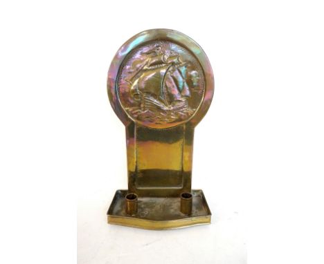 ARTS AND CRAFTS EMBOSSED COPPER CANDLE WALL SCONCE
depicting a Galleon on high seas, the trough with provision for two candle
