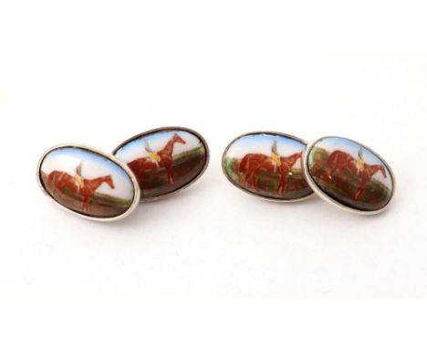 PAIR OF SILVER AND ENAMEL CUFFLINKS
each of the four oval enamel panels depicting a racehorse and jockey