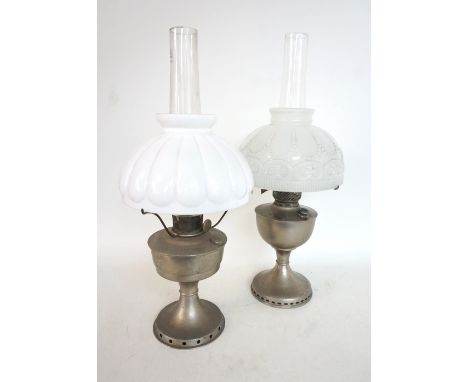 ALADDIN OIL LAMP
with an opaque flared glass shade above a metal body with a pierced foot, together with a Famos oil lamp wit