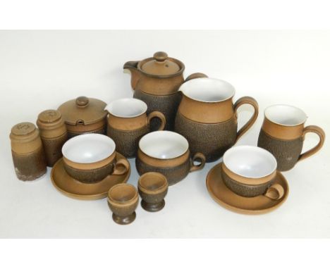 DENBY COTSWOLD PATTERN PART SERVICE
comprising three coffee pots, six milk jugs of various sizes, four egg cups, salt and pep