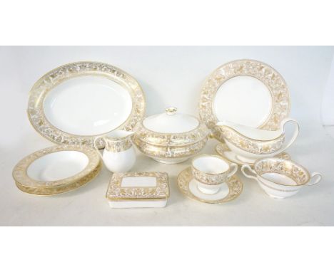 WEDGWOOD 'GOLD FLORENTINE' TEA/DINNER SERVICE
comprising six cups; six saucers; twelve sideplates; cakeplate; sugar basin and