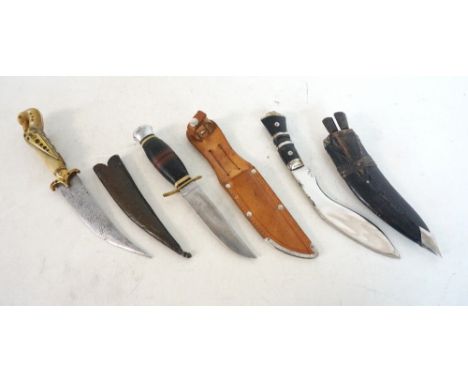 GERMAN HUNTING KNIFE
by 'Puma Solingen', with leather ringed grip, a Middle-Eastern dagger with brass mounted and inset carve