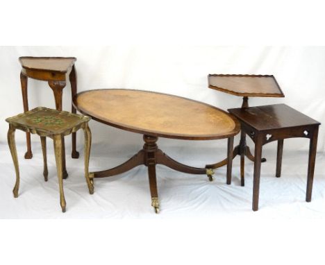 GEORGIAN STYLE MAHOGANY OCCASIONAL TABLE
with an oval leather inset top on four outswept supports with brass lion paw feet; a