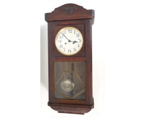 1920's OAK CASED WALL CLOCK
with key and pendulum, 78cm high 