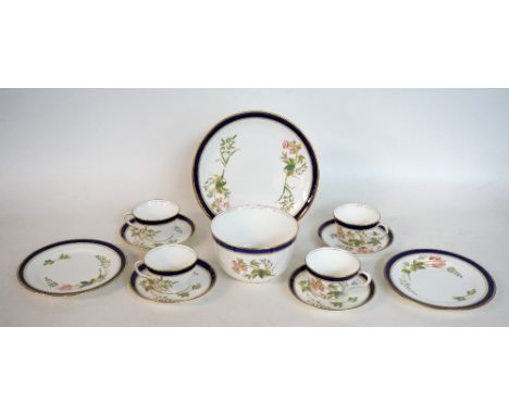 EDWARDIAN CHINA TEA SET
the printed floral design within a gilt and blue border on white ground, comprising six cups; six sau