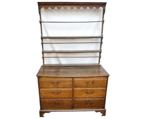 MID 18th CENTURY OAK MULE CHEST
with a lift up lid above four dummy drawers and two lower drawers, all with brass handles, wi