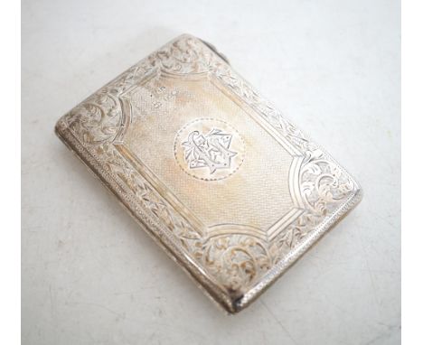 VICTORIAN SILVER AIDE DE MEMOIRE 
with engine turned decoration opening to reveal a satin lined interior with an ivory sheet 