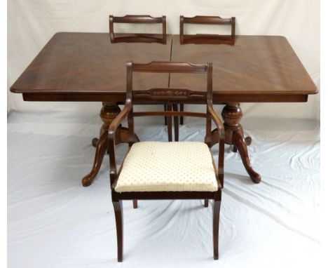 MAHOGANY EXTENDING DINING TABLE
with two extra leaves and standing on twin turned columns with tripod bases, 223cm extended; 