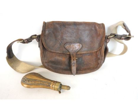 LEATHER CARTRIDGE BAG
with an adjustable webbing and leather strap, together with a chain embossed brass shot flask  