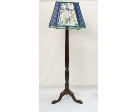 REGENCY STYLE MAHOGANY STANDARD LAMP
the reeded shaped column with three outswept supports with paw feet, 156cm high excludin