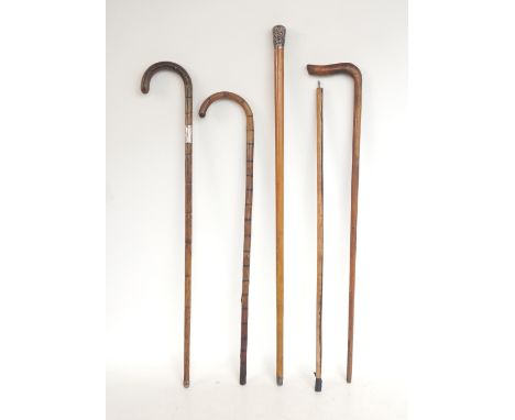 SILVER TOP MALACCA WALKING CANE
London with a rubbed date letter, a silver collared walking stick, London 1914 and three othe