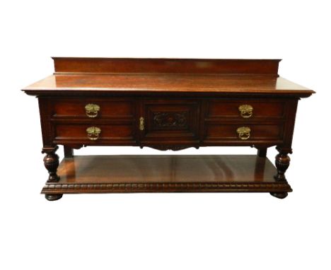 LATE 18th CENTURY STYLE MAHOGANY SIDEBOARD
with a raised back above a central carved cupboard door flanked by two pairs of dr