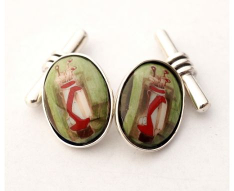 PAIR OF SILVER AND ENAMEL GOLFING CUFFLINKS
the two oval enamel panels depicting a golf bag with clubs