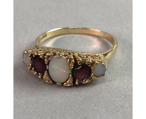 OPAL AND GEM SET RING, the boat shaped bezel set with three graduated opals interspaced by two round red gems, in nine carat 