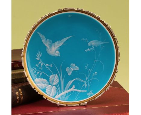A Minton pâte-sur-pâte cabinet plate, by Désiré Leroy (1840-1908), decorated with birds, flora, a dragonfly and butterfly, re