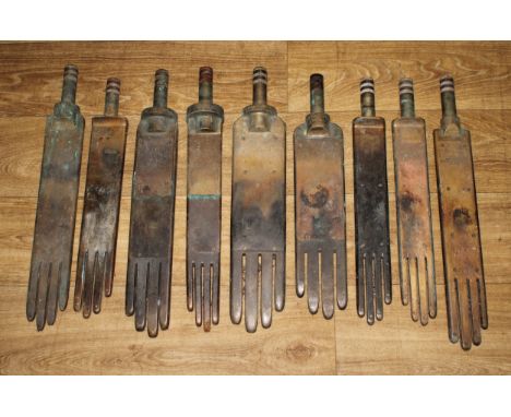 Industrial Salvage - a suite of nine early 20th century brass glover’s glove irons, various maker’s and sizes, one stamped MA