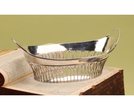 Paul Storr - a George III silver boat shaped bread basket, reeded rim above a border of wire-work arches, 31cm wide, London 1