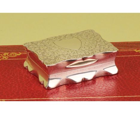 A Victorian silver shaped serpentine snuff box, bright-cut engraved with leaves, hinged cover enclosing a gilt interior, 6cm 