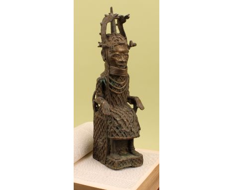 Tribal Art - a Benin bronze figure, of an Oba, seated on his throne, 42cm high, Nigeria