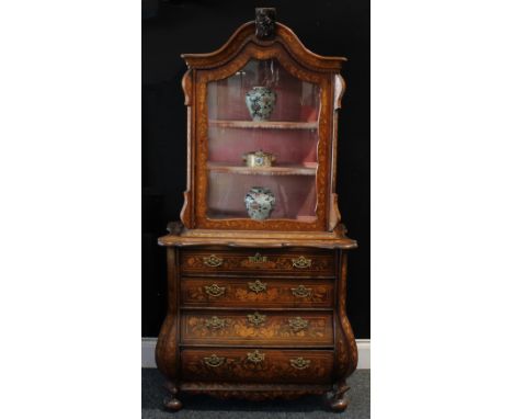 An early 19th century Dutch marquetry vitrine on chest, chapeau de gendarme cresting above a glazed door enclosing two shelve