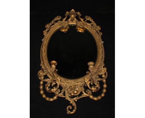 A 19th century Rococo Revival giltwood and gesso pier girandole, oval mirror plate, the frame with scrolling acanthus, floral