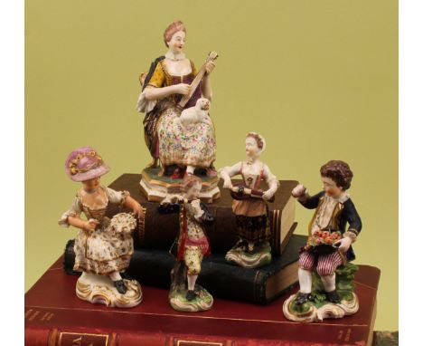 A Derby figure, of a lady musician, playing a lute with a spaniel in her lap, in polychrome picked out in gilt, chamfered rec