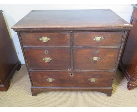 An early Georgian oak chest converted to a single drawer and cupboard standing on bracket feet width 92cm x depth 58cm x heig