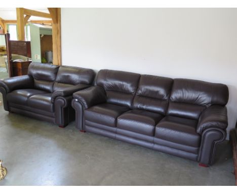 Two pre owned brown leather sofa's - three seater sofa and a matching two seater sofa - 2.15 m long and 1.6 m long by 1 m dee