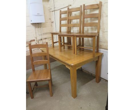 An oak table measuring 152cm x 91cm and four ladder back chairs