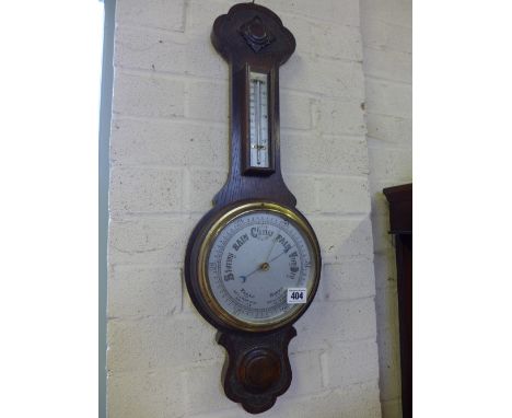 An oak carved Aneroid barometer thermometer - Height 66 cm 
Condition report: Missing a piece of moulding 