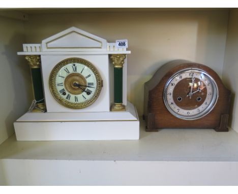 A steel/iron cased Ansonia mantle clock with enamel face, movement stamped Ansonia, strikes on a gong, clock case re painted 