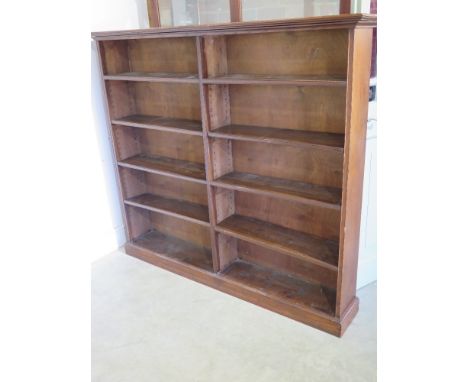 An oak double bookcase with adjustable shelves 1.55m wide x 28cm deep x 1.4m tall shelf depth 20cm