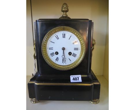 A 19th century French slate mantle clock with ormolu decoration, white enamel face with Roman numerals, movement stamped A.C 