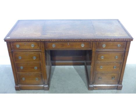 A late Victorian aesthetic movement inlaid mahogany nine drawer kneehole desk with a leather inset top - Height 73 cm x Width