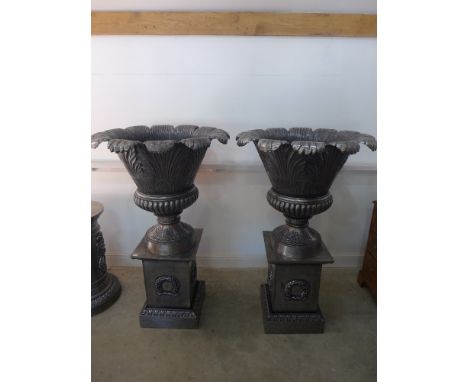An impressive pair of polished cast iron leaf shaped urns on stands - Height 1.43 m x Diameter 90 cm 