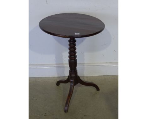 A Georgian and later oak tripod side table with a turned stem and down swept legs