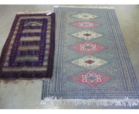 A handknotted Eastern rug - 1.86 m x 1.26 m and a smaller rug 1.42 m x 77 cm



