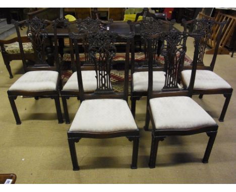 A set of six carved mahogany Chinese Chippendale style chairs