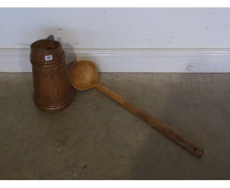 A very unusual early 20th century wooden jug together with large wooden ladle